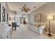 Spacious living room with tile floors and access to the entryway at 5253 Brighton Shore Dr, Apollo Beach, FL 33572