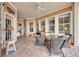 Spacious covered patio with wicker furniture and water views at 5253 Brighton Shore Dr, Apollo Beach, FL 33572