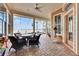 Relaxing covered patio overlooking the water with wicker furniture at 5253 Brighton Shore Dr, Apollo Beach, FL 33572