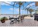 Screened patio with table and chairs, offering scenic water views at 5253 Brighton Shore Dr, Apollo Beach, FL 33572