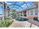 Relaxing pool and spa area with screened enclosure and water view at 5253 Brighton Shore Dr, Apollo Beach, FL 33572