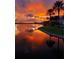 Stunning sunset over the water, reflecting on the calm surface at 5253 Brighton Shore Dr, Apollo Beach, FL 33572
