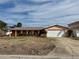 Single story home with a large yard at 6437 1St Palm Pt, St Pete Beach, FL 33706