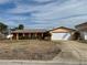 Single story home with a large yard at 6437 1St Palm Pt, St Pete Beach, FL 33706