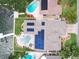 Bird's eye view of a home with solar panels and a pool at 725 Capri Blvd, Treasure Island, FL 33706