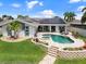 Single-Gathering home with pool, spa, and lush landscaping at 725 Capri Blvd, Treasure Island, FL 33706