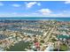 Wide aerial view of the property and surrounding waterfront community at 725 Capri Blvd, Treasure Island, FL 33706