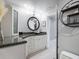 Modern bathroom with a floating vanity and granite countertop at 725 Capri Blvd, Treasure Island, FL 33706