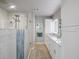 Spa-like bathroom with walk-in shower and double vanity at 725 Capri Blvd, Treasure Island, FL 33706