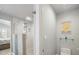Modern bathroom with a glass-enclosed shower and a small toilet area at 725 Capri Blvd, Treasure Island, FL 33706