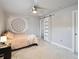 Bright bedroom with a single bed, ceiling fan and an ensuite bathroom at 725 Capri Blvd, Treasure Island, FL 33706