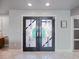 Elegant entryway with double doors featuring a stained-glass design at 725 Capri Blvd, Treasure Island, FL 33706