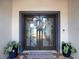 Stylish double front doors with geometric glass panes at 725 Capri Blvd, Treasure Island, FL 33706