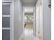 Bright hallway with tile flooring and access to bedrooms at 725 Capri Blvd, Treasure Island, FL 33706