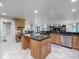 Open concept kitchen with large island and granite countertops at 725 Capri Blvd, Treasure Island, FL 33706