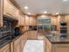 Spacious kitchen with stainless steel appliances and granite countertops at 725 Capri Blvd, Treasure Island, FL 33706
