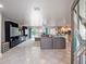 Spacious living room with large sectional sofa,water views, and modern entertainment center at 725 Capri Blvd, Treasure Island, FL 33706