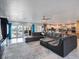 Open floor plan with large sectional sofa, kitchen, and access to the backyard and pool at 725 Capri Blvd, Treasure Island, FL 33706