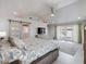 Main bedroom with vaulted ceiling, sliding barn door and water view at 725 Capri Blvd, Treasure Island, FL 33706