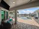 Relaxing patio with pool and water views, comfortable seating, and outdoor dining at 725 Capri Blvd, Treasure Island, FL 33706