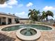 Inviting pool and spa with brick pavers and lush landscaping at 725 Capri Blvd, Treasure Island, FL 33706