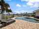 Inviting pool area with lounge chairs, creating a relaxing outdoor space at 725 Capri Blvd, Treasure Island, FL 33706