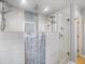 Walk-in shower with dual shower heads and modern tile and glass at 725 Capri Blvd, Treasure Island, FL 33706