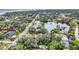Wide aerial view showcasing the neighborhood and waterfront at 751 Pinellas Point S Dr, St Petersburg, FL 33705