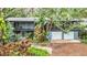 Elevated view of a home nestled in a tree-lined neighborhood at 751 Pinellas Point S Dr, St Petersburg, FL 33705