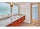 Clean bathroom, featuring a tiled vanity and a door leading outside at 751 Pinellas Point S Dr, St Petersburg, FL 33705