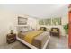 Bright bedroom with double bed, two armchairs, and ample natural light at 751 Pinellas Point S Dr, St Petersburg, FL 33705