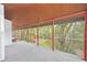 Covered porch with access to living room and backyard, perfect for relaxing at 751 Pinellas Point S Dr, St Petersburg, FL 33705