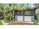 Ranch style home with mature landscaping and a two-car garage at 751 Pinellas Point S Dr, St Petersburg, FL 33705