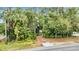 Home with a long driveway, nestled among tropical foliage at 751 Pinellas Point S Dr, St Petersburg, FL 33705