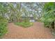 Home situated on a lot with mature trees and landscaping at 751 Pinellas Point S Dr, St Petersburg, FL 33705