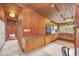 Retro kitchen with wood cabinets and tiled backsplash at 751 Pinellas Point S Dr, St Petersburg, FL 33705