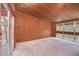 Spacious living room with wood paneled walls and large windows at 751 Pinellas Point S Dr, St Petersburg, FL 33705