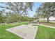 Park-like setting with picnic tables and grills at 751 Pinellas Point S Dr, St Petersburg, FL 33705