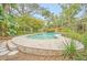 Expansive kidney-shaped pool with a large patio area at 751 Pinellas Point S Dr, St Petersburg, FL 33705