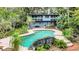 Inviting kidney-shaped pool with rock waterfall at 751 Pinellas Point S Dr, St Petersburg, FL 33705