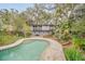 Beautiful kidney-shaped pool and home exterior view at 751 Pinellas Point S Dr, St Petersburg, FL 33705