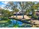 House with screened porch, overlooking a peaceful lake at 8304 Palma Vista Ln, Tampa, FL 33614