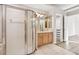 Bathroom with shower, vanity, and walk-in closet at 9116 Exposition Dr, Tampa, FL 33626