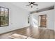Bright bedroom with hardwood floors and an ensuite bathroom at 9116 Exposition Dr, Tampa, FL 33626