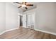 Bedroom with mirrored closet and ceiling fan at 9116 Exposition Dr, Tampa, FL 33626