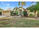 Beautiful home exterior with attached garage and landscaping at 9116 Exposition Dr, Tampa, FL 33626