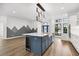 Modern kitchen with a large island and stainless steel appliances at 9116 Exposition Dr, Tampa, FL 33626