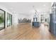 Modern kitchen with a large island and stainless steel appliances at 9116 Exposition Dr, Tampa, FL 33626