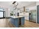 Modern kitchen with a large island and stainless steel appliances at 9116 Exposition Dr, Tampa, FL 33626
