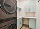 Modern laundry room with stylish cabinets and new appliances at 9116 Exposition Dr, Tampa, FL 33626